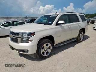 2015 Chevrolet Tahoe LT with VIN 1GNSCBKC5FR302611, listed as a Copart auction lot 62068165 with 184,136 mi miles and Salvage title. Bid and sale history available at DreamBid. Image 1.