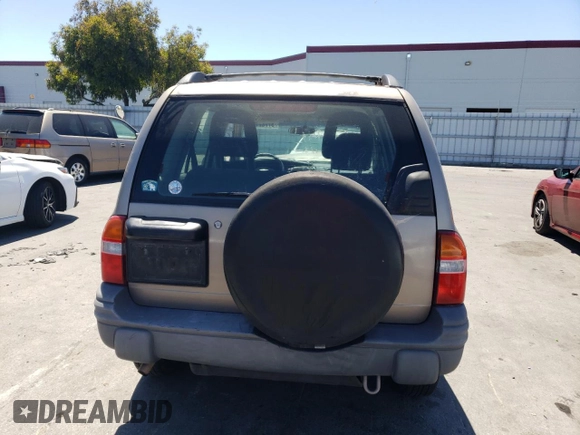 2002 Chevrolet Tracker z VIN 2CNBJ13C026951435, wystawiony jako Copart lot #57782784 z przebiegiem 132 279 mil mil oraz Szkoda całkowita • Salvage title. Historia ofert i sprzedaży dostępna na DreamBid. Obrazek 6.