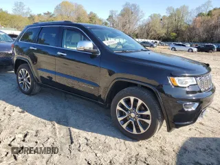 2017 Jeep Grand Cherokee Overland with VIN 1C4RJFCT3HC755960, listed as a Copart auction lot 52268895 with 99,998 mi miles and Salvage title. Bid and sale history available at DreamBid. Image 4.