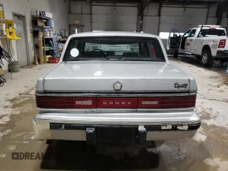 1989 Dodge Dynasty z VIN 1B3BC4634KD442902, wystawiony jako Copart lot #85151394 z przebiegiem 63 120 mil mil oraz Czysty tytuł • Clean title. Historia ofert i sprzedaży dostępna na DreamBid. Obrazek 6.