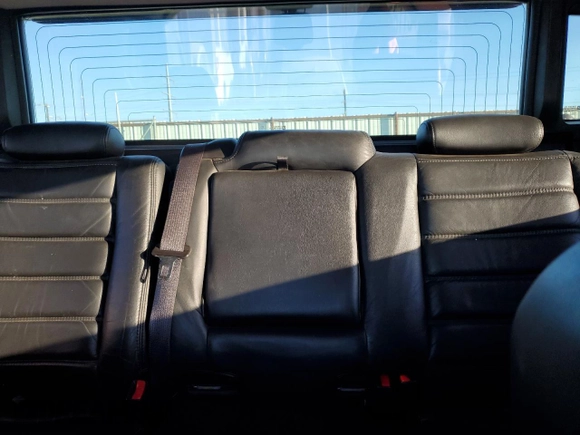 2005 Hummer H2 SUT z VIN 5GRGN22U85H109003, wystawiony jako Copart lot #76557734 z przebiegiem 115 249 mil mil oraz Szkoda całkowita • Salvage title. Historia ofert i sprzedaży dostępna na DreamBid. Obrazek 10.