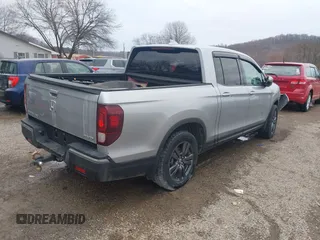 2020 Honda Ridgeline Sport with VIN 5FPYK3F13LB023123, listed as a IAAI auction lot 41694273 with 51,934 mi miles and . Bid and sale history available at DreamBid. Image 4.