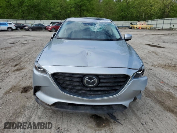 2023 Mazda CX-9 Touring Plus with VIN JM3TCBAY1P0659517, listed as a Copart auction lot 56396565 with 50,544 mi miles and Salvage title. Bid and sale history available at DreamBid. Image 5.