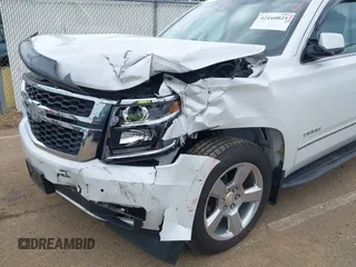 2020 Chevrolet Tahoe LT with VIN 1GNSCBKC4LR181887, listed as a IAAI auction lot 42160821 with 106,757 mi miles and . Bid and sale history available at DreamBid. Image 6.