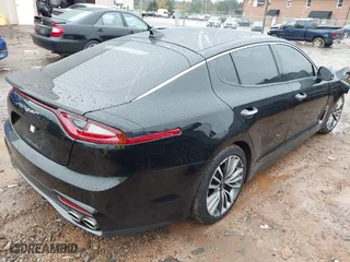 2019 Kia Stinger Premium with VIN KNAE25LAXK6059586, listed as a IAAI auction lot 40913071 with 48,511 mi miles. Bid and sale history available at carsss.com. Image 4.