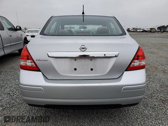 2011 Nissan Versa S with VIN 3N1BC1AP9BL458761, listed as a Copart auction lot 57317115 with 122,606 mi miles and Salvage title. Bid and sale history available at DreamBid. Image 6.
