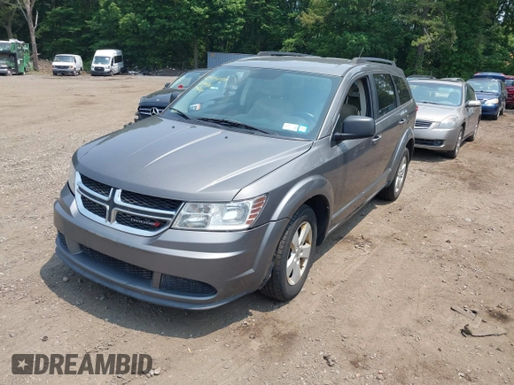 2013 Dodge Journey American Value z VIN 3C4PDCAB0DT691429, wystawiony jako IAAI lot #42514055 z przebiegiem 213 593 mil mil oraz . Historia ofert i sprzedaży dostępna na DreamBid. Obrazek 2.