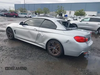 2015 BMW 4 Series 428i with VIN WBA3V7C50FP772915, listed as a IAAI auction lot 41526014 with 116,800 mi miles. Bid and sale history available at carsss.com. Image 3.