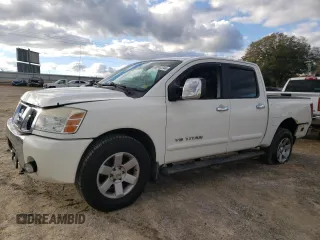 2005 Nissan Titan LE z VIN 1N6BA07B15N538209, wystawiony jako Copart lot #80747244 z przebiegiem 166 352 mil mil oraz Szkoda całkowita • Salvage title. Historia ofert i sprzedaży dostępna na DreamBid. Obrazek 1.