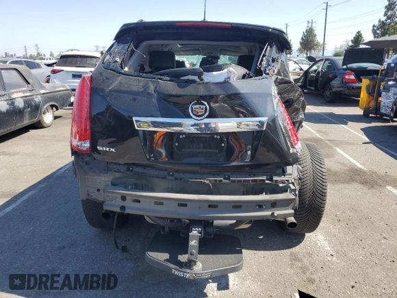 2015 Cadillac SRX Performance Collection с VIN 3GYFNCE38FS607680, выставлен на аукционе Copart как лот 62929235 с пробегом 55 638 миль миль и Списание • Salvage title. История ставок и продаж доступна на DreamBid. Изображение 6.