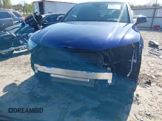 2023 Audi Q5 S line Premium Plus z VIN WA1EAAFY6P2038315, wystawiony jako IAAI lot #41990125 z przebiegiem 31 787 mil mil oraz . Historia ofert i sprzedaży dostępna na DreamBid. Obrazek 6.