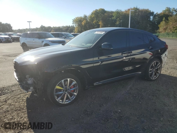 2021 BMW X4 M40i with VIN 5UX2V5C05M9H59295, listed as a Copart auction lot 71312963 with 31,050 mi miles. Bid and sale history available at carsss.com. Image 1.