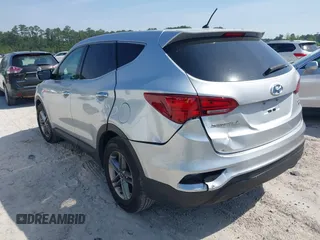 2018 Hyundai Santa Fe 2.4L z VIN 5XYZTDLB9JG513584, wystawiony jako IAAI lot #42031291 z przebiegiem 131 109 mil mil oraz . Historia ofert i sprzedaży dostępna na DreamBid. Obrazek 3.