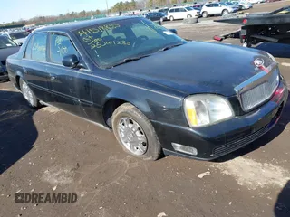 2004 Cadillac DeVille DHS z VIN 1G6KE57YX4U261849, wystawiony jako IAAI lot #41518835 z przebiegiem Nie podano mil oraz . Historia ofert i sprzedaży dostępna na DreamBid. Obrazek 1.