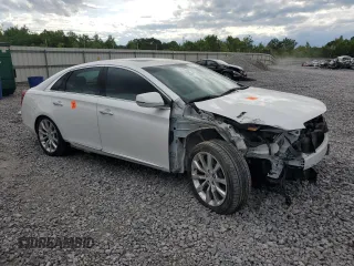 2016 Cadillac XTS Luxury Collection with VIN 2G61M5S34G9209483, listed as a Copart auction lot 54611105 with 23,778 mi miles and Salvage title. Bid and sale history available at DreamBid. Image 4.