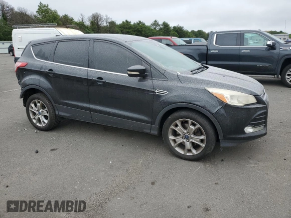 2013 Ford Escape SEL with VIN 1FMCU9H92DUA86916, listed as a Copart auction lot 63516415 with 167,791 mi miles and Salvage title. Bid and sale history available at DreamBid. Image 4.