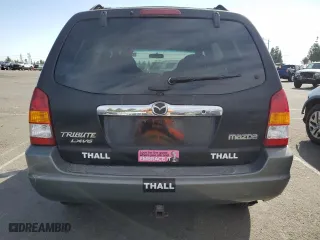 2001 Mazda Tribute LX with VIN 4F2YU09151KM38909, listed as a Copart auction lot 77808264 with 136,005 mi miles and Salvage Title. Bid and sale history available at carsss.com. Image 6.