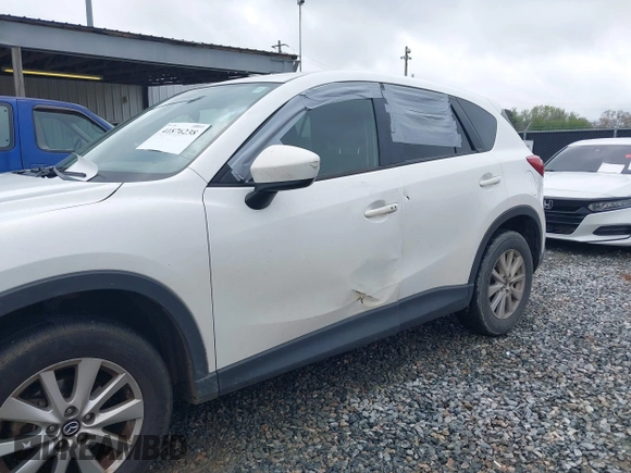 2015 Mazda CX-5 Touring with VIN JM3KE2CY4F0436664, listed as a IAAI auction lot 41876238 with 374,305 mi miles. Bid and sale history available at carsss.com. Image 6.