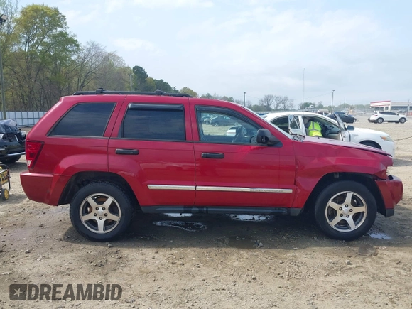 2005 Jeep Grand Cherokee Laredo with VIN 1J4HS48N95C711992, listed as a IAAI auction lot 41944696 with 209,299 mi miles and . Bid and sale history available at DreamBid. Image 13.