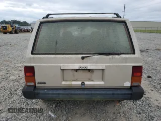 1995 Jeep Cherokee Sport with VIN 1J4FJ68S4SL618773, listed as a Copart auction lot 74126954 with 318,519 mi miles and Salvage title. Bid and sale history available at DreamBid. Image 6.