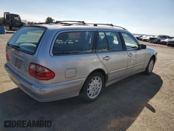 2001 Mercedes-Benz E-Class AWD with VIN WDBJH82J11X056425, listed as a Copart auction lot 48612975 with 130,900 mi miles and Salvage Title. Bid and sale history available at carsss.com. Image 3.
