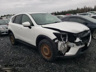 2014 Mazda CX-5 Touring z VIN JM3KE4CY1E0406726, wystawiony jako Copart lot #54652065 z przebiegiem 245 491 mil mil oraz Szkoda całkowita • Salvage title. Historia ofert i sprzedaży dostępna na DreamBid. Obrazek 4.