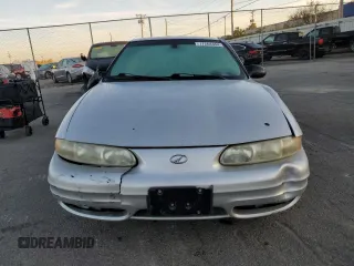 2003 Oldsmobile Alero GL1 z VIN 1G3NL52F13C182905, wystawiony jako Copart lot #77264384 z przebiegiem Nie podano mil oraz Szkoda całkowita • Salvage title. Historia ofert i sprzedaży dostępna na DreamBid. Obrazek 5.