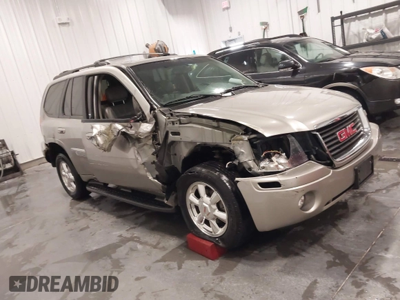 2003 GMC Envoy SLT with VIN 1GKDT13S932395367, listed as a IAAI auction lot 41544810 with 142,012 mi miles. Bid and sale history available at carsss.com. Image 1.