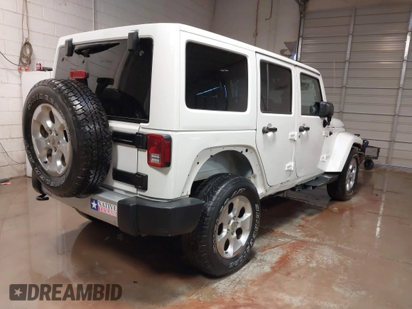 2014 Jeep Wrangler Unlimited Sahara with VIN 1C4BJWEG1EL326605, listed as a IAAI auction lot 41325037 with 135,824 mi miles. Bid and sale history available at carsss.com. Image 4.
