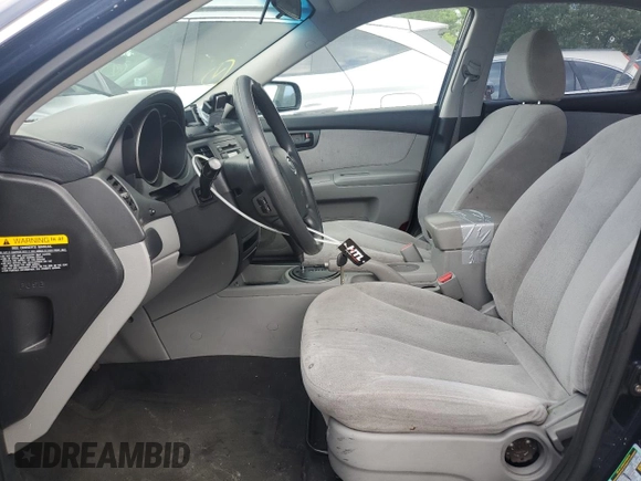 2010 Kia Optima LX z VIN KNAGG4A80A5398981, wystawiony jako Copart lot #59092515 z przebiegiem 153 524 mil mil oraz Szkoda całkowita • Salvage title. Historia ofert i sprzedaży dostępna na DreamBid. Obrazek 7.