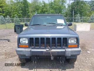 2001 Jeep Cherokee Sport z VIN 1J4FF48S51L531033, wystawiony jako IAAI lot #42423910 z przebiegiem 90 438 mil mil oraz . Historia ofert i sprzedaży dostępna na DreamBid. Obrazek 6.