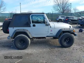 2003 Jeep Wrangler X with VIN 1J4FA39S33P363153, listed as a IAAI auction lot 41584805 with 160,676 mi miles. Bid and sale history available at carsss.com. Image 14.