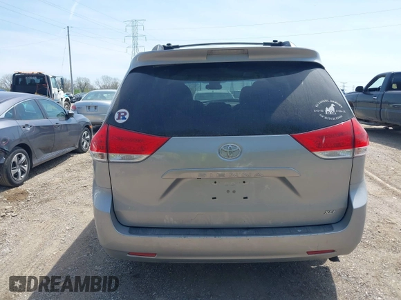 2014 Toyota Sienna XLE with VIN 5TDYK3DC9ES413283, listed as a IAAI auction lot 42091379 with 184,506 mi miles and . Bid and sale history available at DreamBid. Image 16.