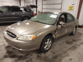 2003 Ford Taurus SES Standard with VIN 1FAFP552X3G184894, listed as a IAAI auction lot 41846677 with 160,824 mi miles. Bid and sale history available at carsss.com. Image 2.