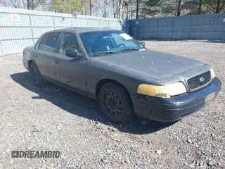 2011 Ford Crown Victoria with VIN 2FABP7AV9BX121739, listed as a IAAI auction lot 41763311 with 215,727 mi miles. Bid and sale history available at carsss.com. Image 1.