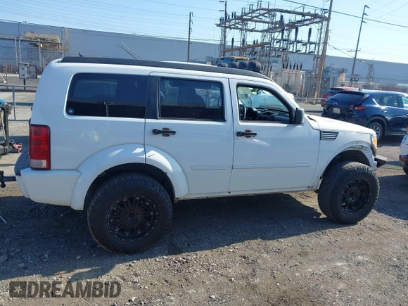 2011 Dodge Nitro Heat with VIN 1D4PT4GK9BW596989, listed as a IAAI auction lot 42397427 with 158,609 mi miles and . Bid and sale history available at DreamBid. Image 13.