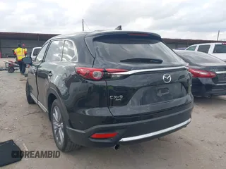 2023 Mazda CX-9 Grand Touring with VIN JM3TCBDY2P0632239, listed as a IAAI auction lot 41543302 with 56,603 mi miles and . Bid and sale history available at carsss.com. Image 3.