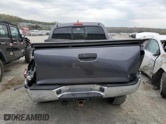 2014 Toyota Tacoma with VIN 3TMLU4EN7EM146056, listed as a Copart auction lot 54554255 with 116,035 mi miles and Salvage Title. Bid and sale history available at DreamBid. Image 6.