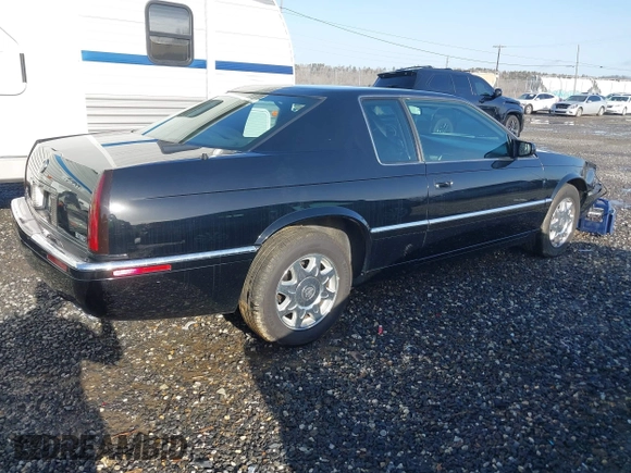 1999 Cadillac Eldorado Touring z VIN 1G6ET129XXU603042, wystawiony jako IAAI lot #41699955 z przebiegiem 81 704 mil mil oraz . Historia ofert i sprzedaży dostępna na DreamBid. Obrazek 4.