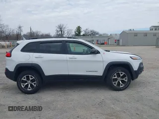 2015 Jeep Cherokee Trailhawk with VIN 1C4PJMBB7FW741365, listed as a IAAI auction lot 41879685 with 94,135 mi miles and . Bid and sale history available at carsss.com. Image 14.