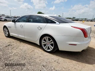 2015 Jaguar XJ Portfolio with VIN SAJWA2GZ7F8V82990, listed as a Copart auction lot 63325535 with 113,892 mi miles and Salvage title. Bid and sale history available at DreamBid. Image 2.