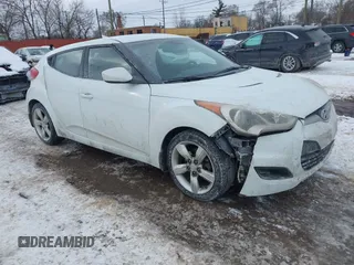 2013 Hyundai Veloster w/Black Int with VIN KMHTC6AD9DU171722, listed as a IAAI auction lot 41617721 with 115,791 mi miles and . Bid and sale history available at DreamBid. Image 1.