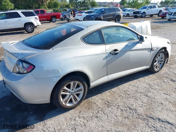 2008 Hyundai Tiburon GS with VIN KMHHM66D98U292591, listed as a IAAI auction lot 42021445 with 219,750 mi miles. Bid and sale history available at carsss.com. Image 4.