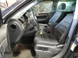 2010 Volkswagen Touareg VR6 with VIN WVGBF7A99AD002591, listed as a Copart auction lot 70624234 with 154,330 mi miles and Salvage Title. Bid and sale history available at DreamBid. Image 7.