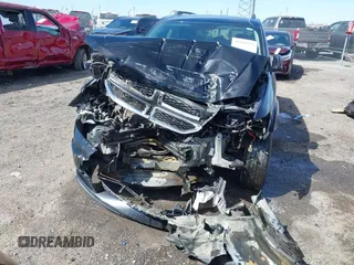 2017 Dodge Journey SE z VIN 3C4PDCAB2HT698940, wystawiony jako IAAI lot #41843176 z przebiegiem 141 499 mil mil oraz . Historia ofert i sprzedaży dostępna na DreamBid. Obrazek 6.