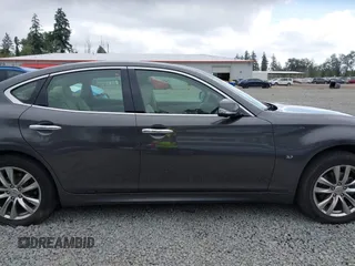 2015 Infiniti Q70 with VIN JN1BY1ARXFM562111, listed as a IAAI auction lot 42473521 with 123,212 mi miles and . Bid and sale history available at DreamBid. Image 13.
