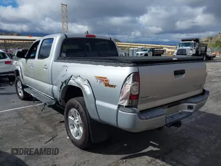 2012 Toyota Tacoma PreRunner with VIN 3TMKU4HN6CM033123, listed as a IAAI auction lot 41478582 with 89,479 mi miles and . Bid and sale history available at DreamBid. Image 3.
