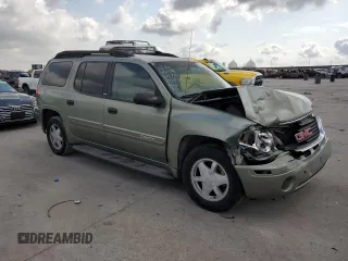 2003 GMC Envoy SLE with VIN 1GKES16P636242632, listed as a Copart auction lot 75960974 with Not Provided miles and Salvage Title. Bid and sale history available at DreamBid. Image 4.