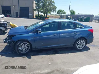 2018 Ford Focus Titanium with VIN 1FADP3J21JL323767, listed as a IAAI auction lot 42375218 with 104,440 mi miles and . Bid and sale history available at DreamBid. Image 14.