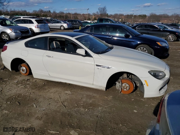 2012 BMW 6 Series 650i xDrive with VIN WBALX5C55CC894302, listed as a Copart auction lot 43796615 with 106,544 mi miles and Salvage Title. Bid and sale history available at carsss.com. Image 4.